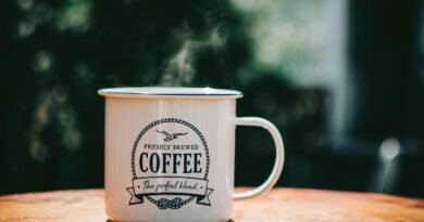 White Coffee Mug on Brown Surface