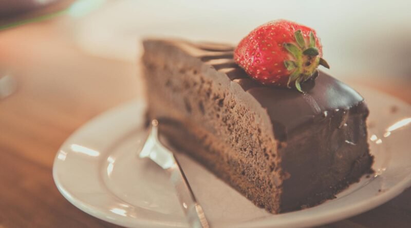 Sliced Chocolate Cake on Ceramic Saucer