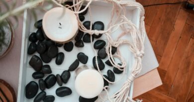 Home decoration with candles and black stones