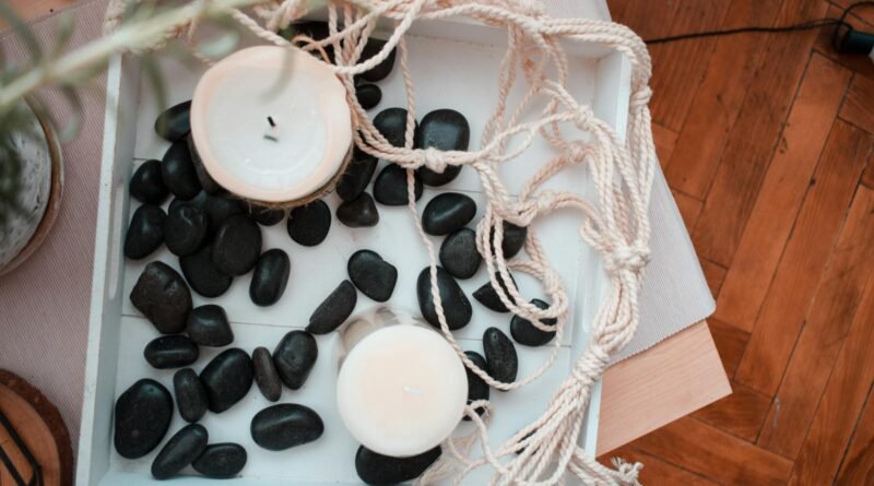 Home decoration with candles and black stones