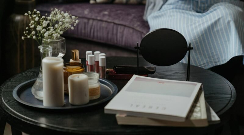 White Pillar Candles on Black Wooden Table