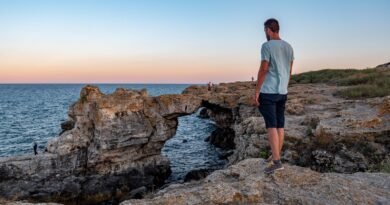 A Man Standing on the Cliff