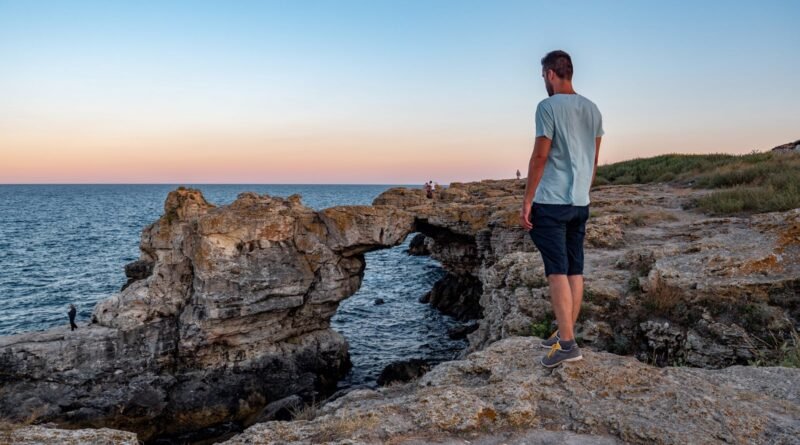 A Man Standing on the Cliff