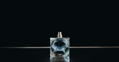 clear glass perfume bottle with black background