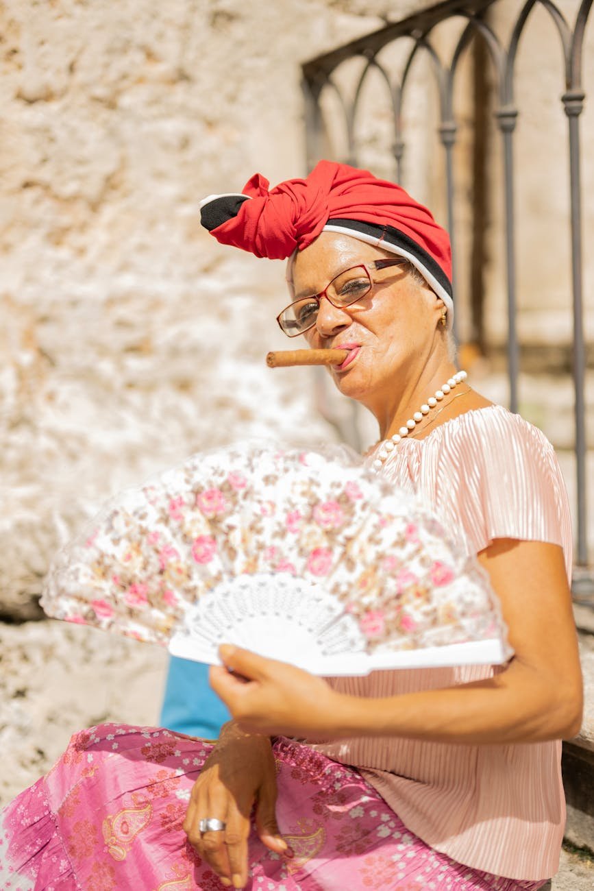 vibrant cuban woman with cigar in havana